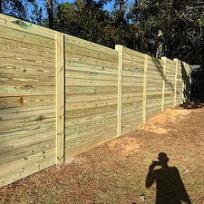 8ft-Horizontal-Privacy-Fence-Installation-with-Deck-Boards-in-Gulfport-MS 0